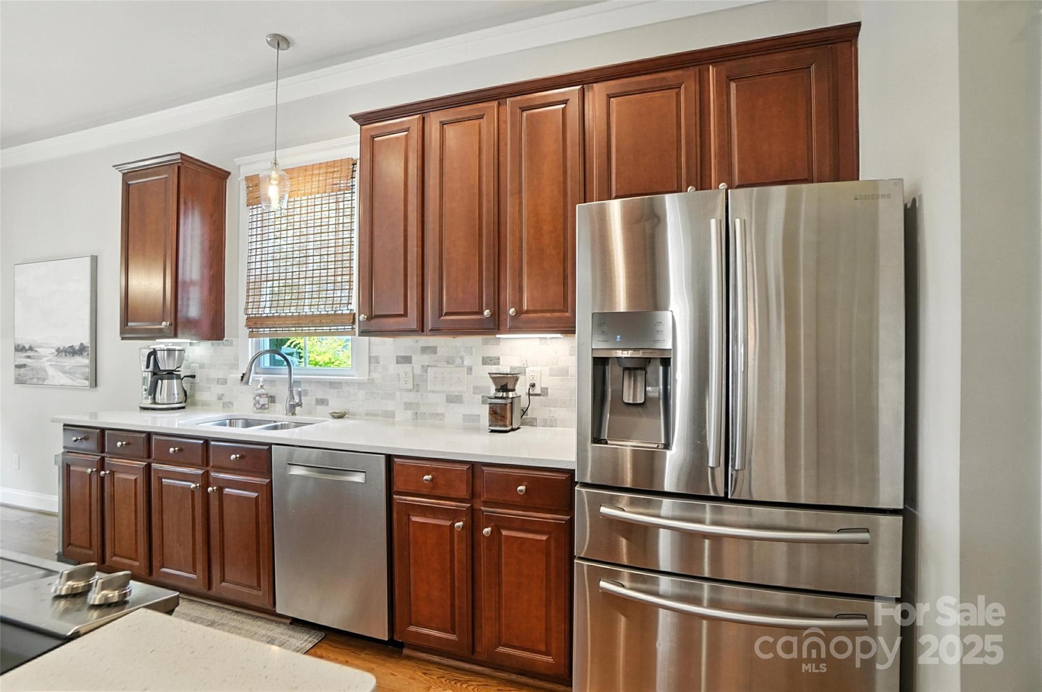 3281 Richard's Crossing Fort Mill, SC 29708 - Photo 25 of 48 a kitchen with stainless steel appliances granite countertop a refrigerator a sink dishwasher and wooden cabinets