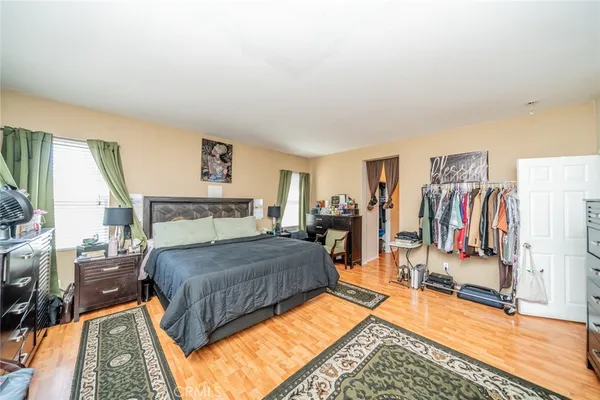 a bedroom with a bed and a walk in closet