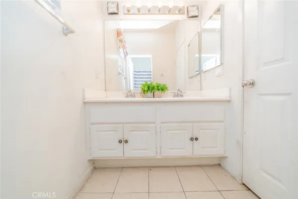 a view of a utility room with cabinets