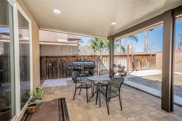 a view of an outdoor dining space with furniture