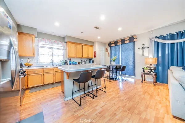 a large kitchen with a table and chairs in it