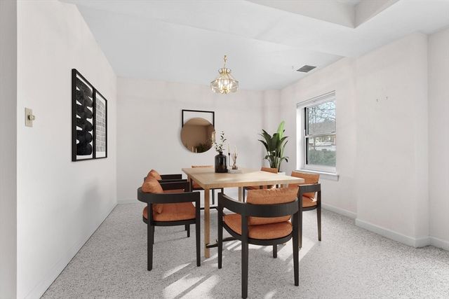 a view of a workspace room with furniture and wooden floor