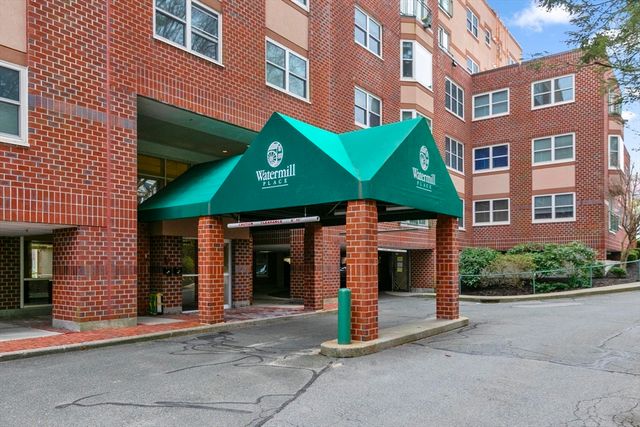 a front view of a building with garden