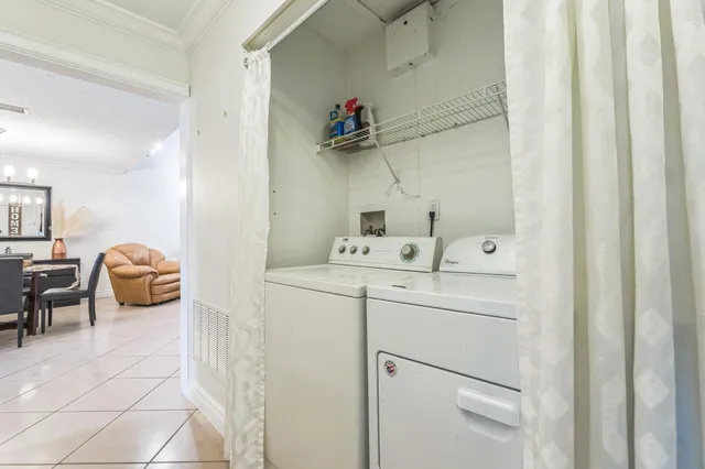a utility room with dryer and washer