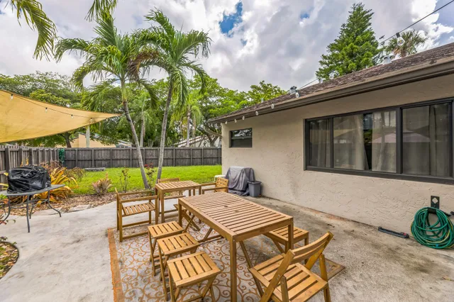 swimming pool with outdoor seating and yard