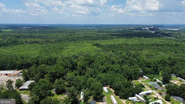 a view of a big yard with lots of green space