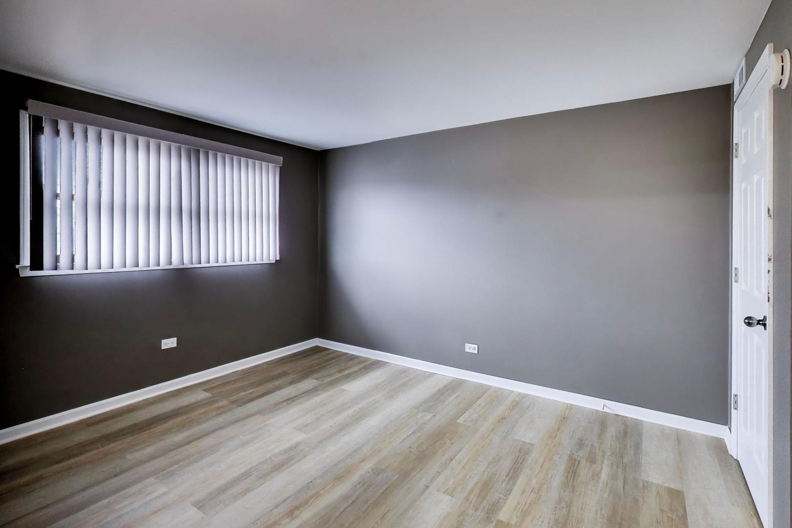 22 North Pistakee Lake Road, Unit 3E Fox Lake, IL 60020 - Photo 11 of 27 a view of an empty room with a window