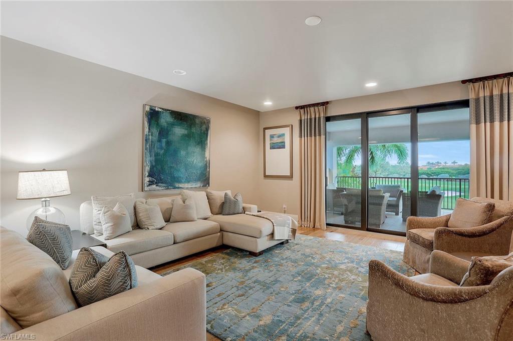 16776 Brightling Way Naples, FL 34110 - Photo 18 of 35 a living room with furniture and a large window