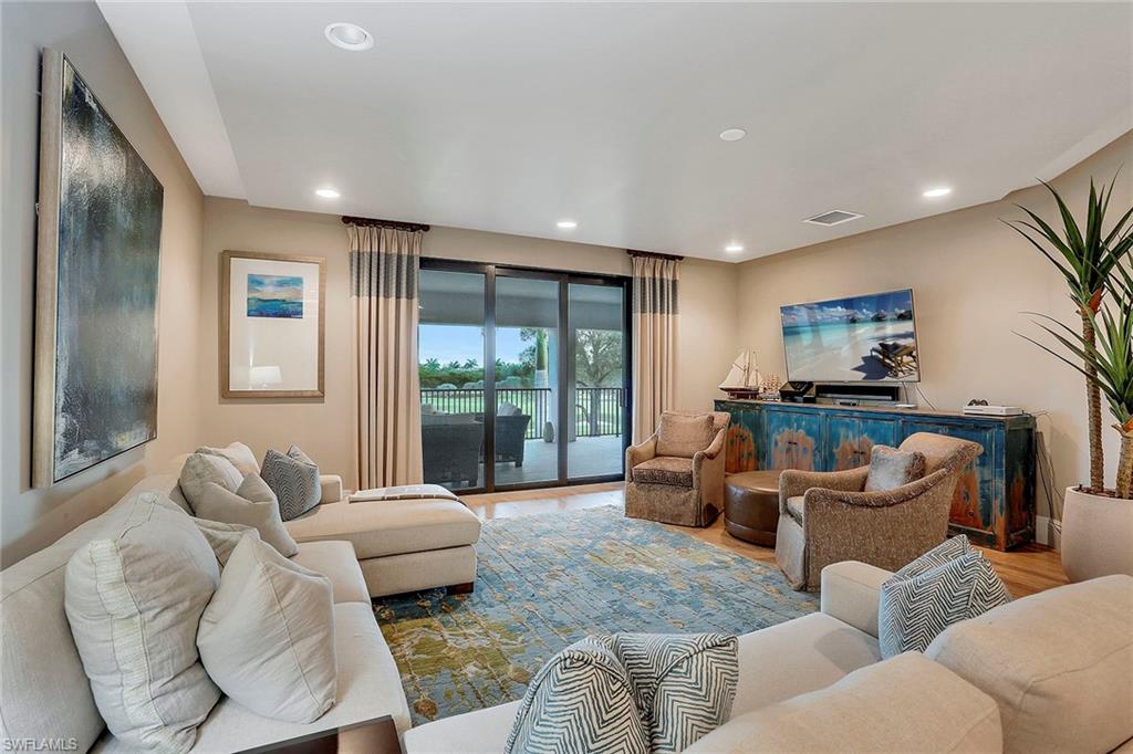 16776 Brightling Way Naples, FL 34110 - Photo 19 of 35 a living room with furniture and a large window