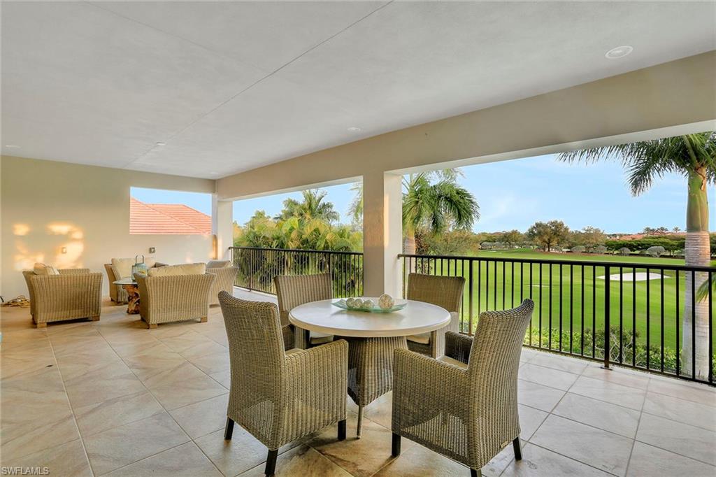 16776 Brightling Way Naples, FL 34110 - Photo 21 of 35 a dining room with furniture and a floor to ceiling window