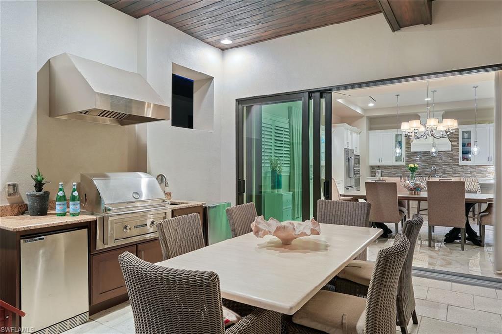 16776 Brightling Way Naples, FL 34110 - Photo 24 of 35 a view of a dining room with furniture window and outside view