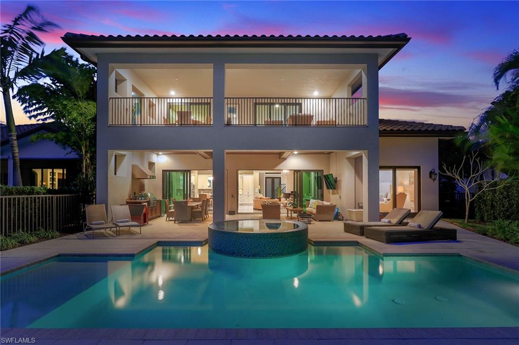 16776 Brightling Way Naples, FL 34110 - Photo 28 of 35 a view of a house with swimming pool and sitting area