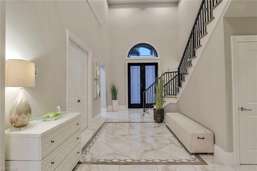 16776 Brightling Way Naples, FL 34110 - Photo 3 of 35 a view of entryway with furniture and wooden floor