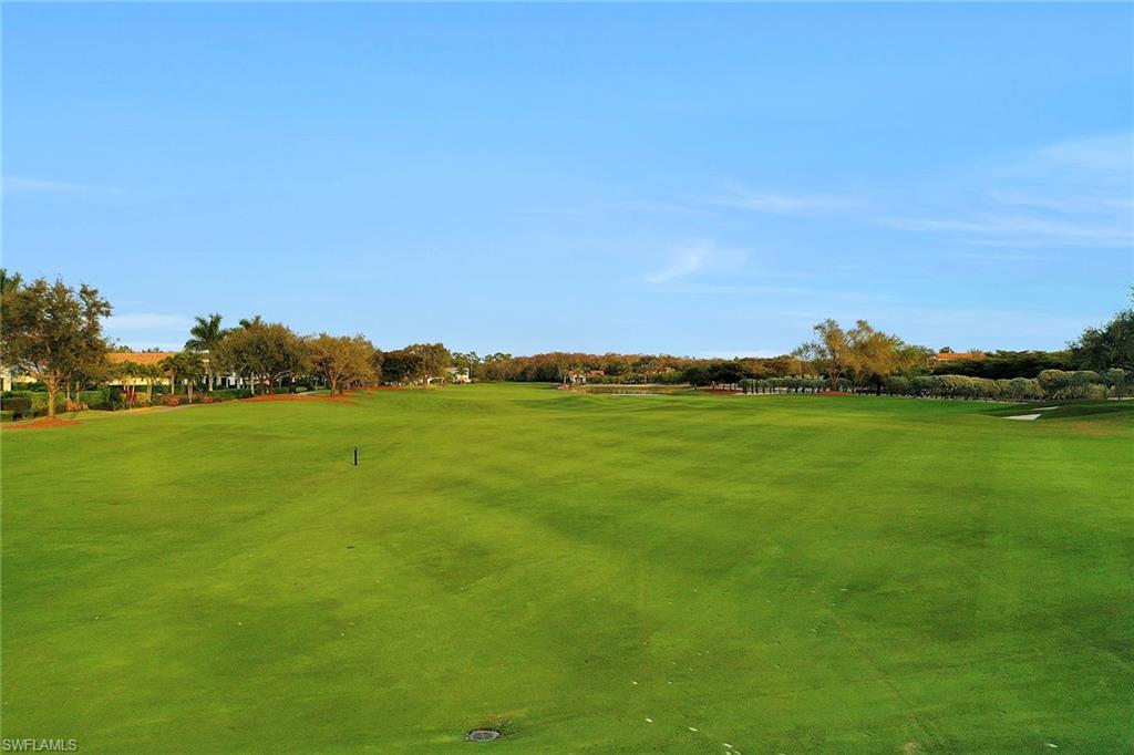 16776 Brightling Way Naples, FL 34110 - Photo 32 of 35 a view of an ocean and a yard