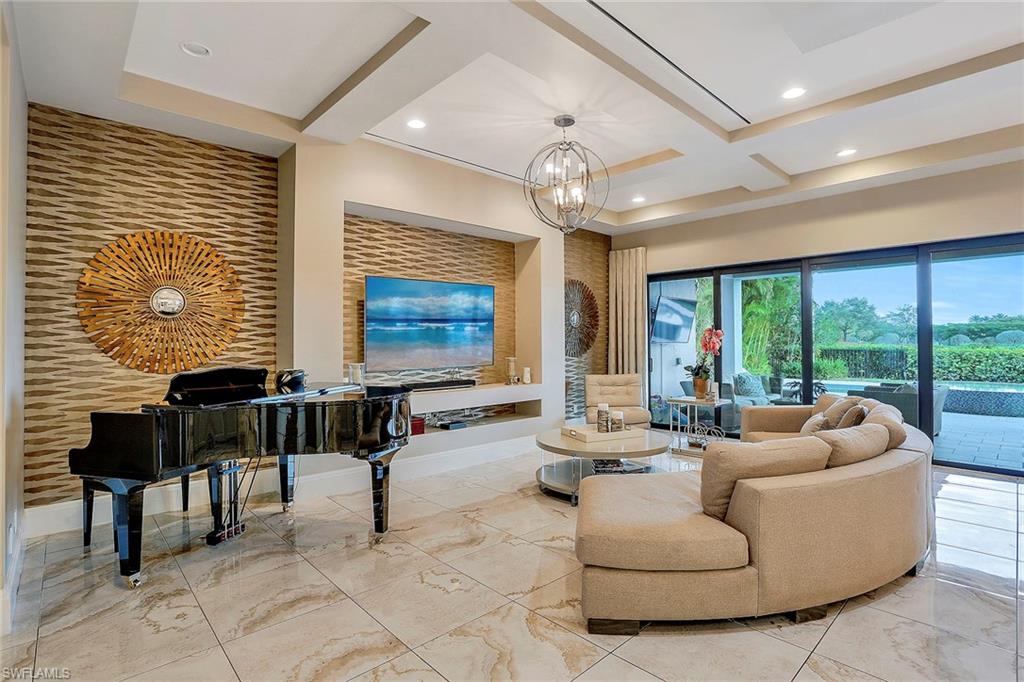 16776 Brightling Way Naples, FL 34110 - Photo 5 of 35 a living room with furniture and a large window