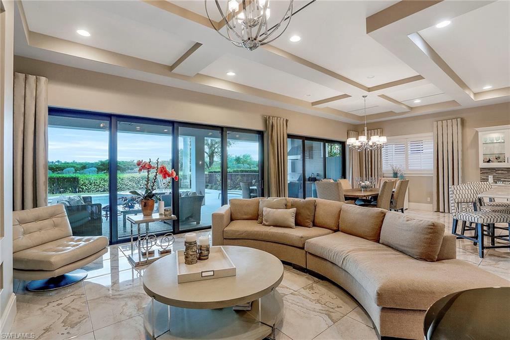 16776 Brightling Way Naples, FL 34110 - Photo 6 of 35 a living room with furniture and a large window