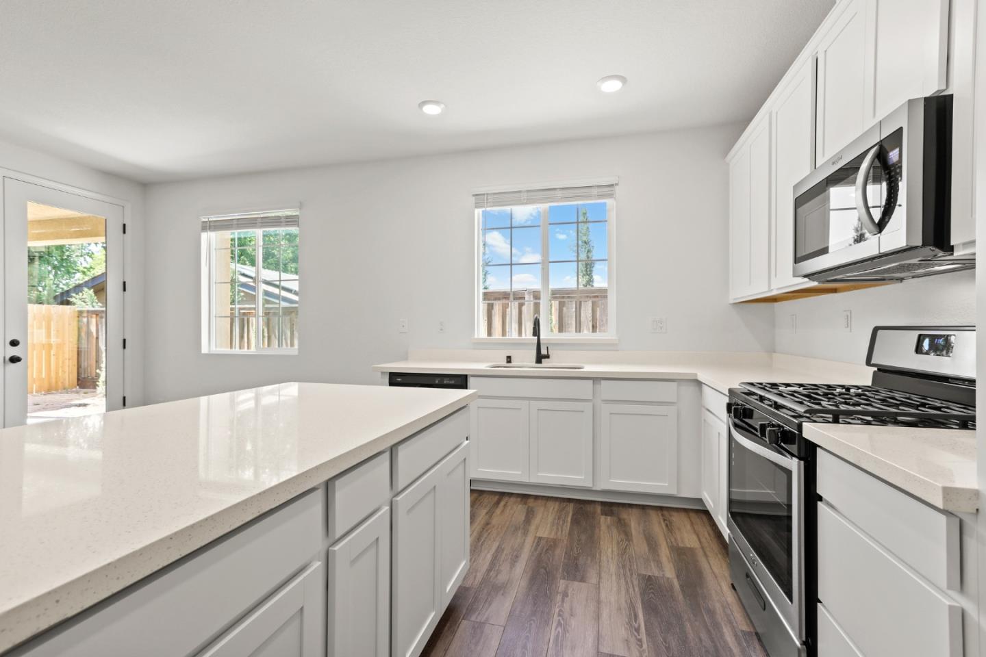 4503 Gray Lodge Loop Rocklin, CA 95677 - Photo 12 of 35 a kitchen with a sink stove and cabinets
