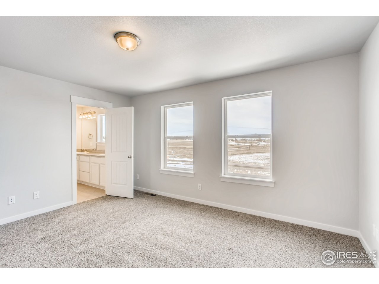 796 Lowry Lane Berthoud, CO 80513 - Photo 17 of 28 a view of an empty room with a window