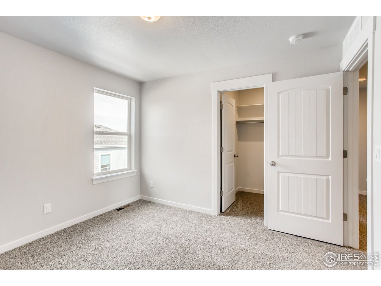 796 Lowry Lane Berthoud, CO 80513 - Photo 22 of 28 a big room with windows and closet