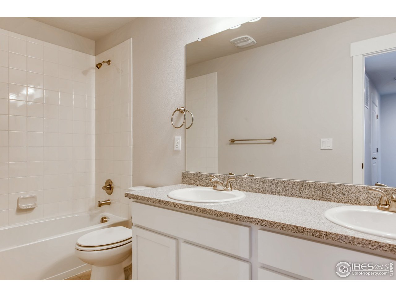 796 Lowry Lane Berthoud, CO 80513 - Photo 23 of 28 a bathroom with a granite countertop sink toilet and shower