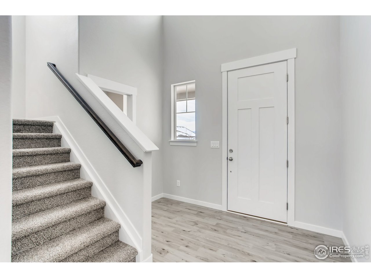796 Lowry Lane Berthoud, CO 80513 - Photo 6 of 28 a view of entryway with wooden floor