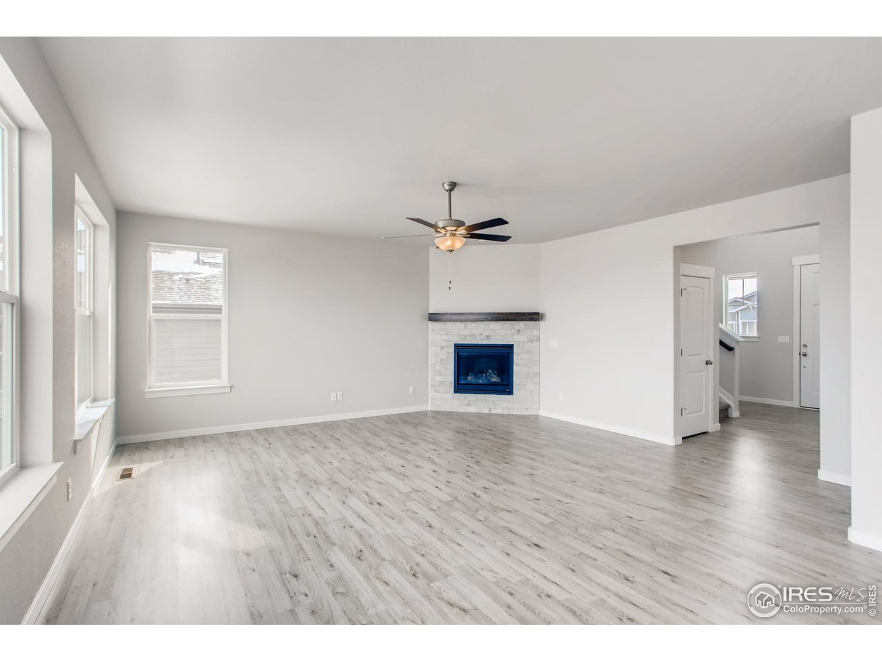 796 Lowry Lane Berthoud, CO 80513 - Photo 8 of 28 a view of an empty room and a fireplace