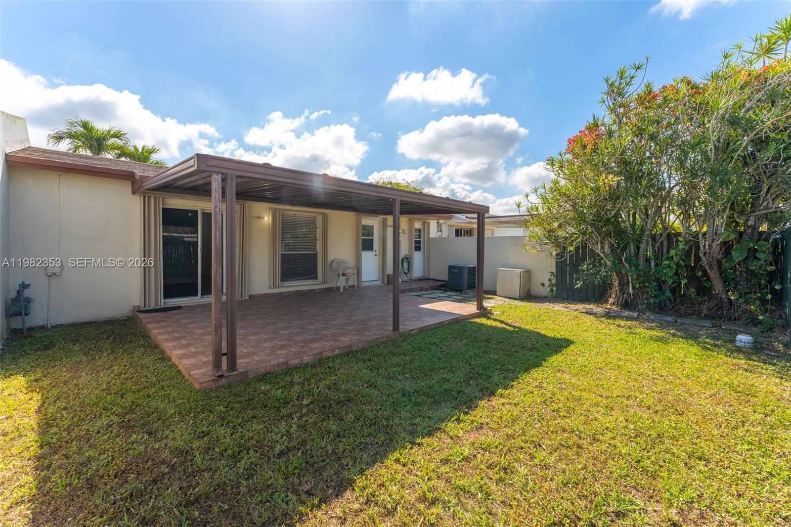12983 Southwest 18th Terrace Miami, FL 33175 - Photo 20 of 25 a view of a house with backyard and sitting area