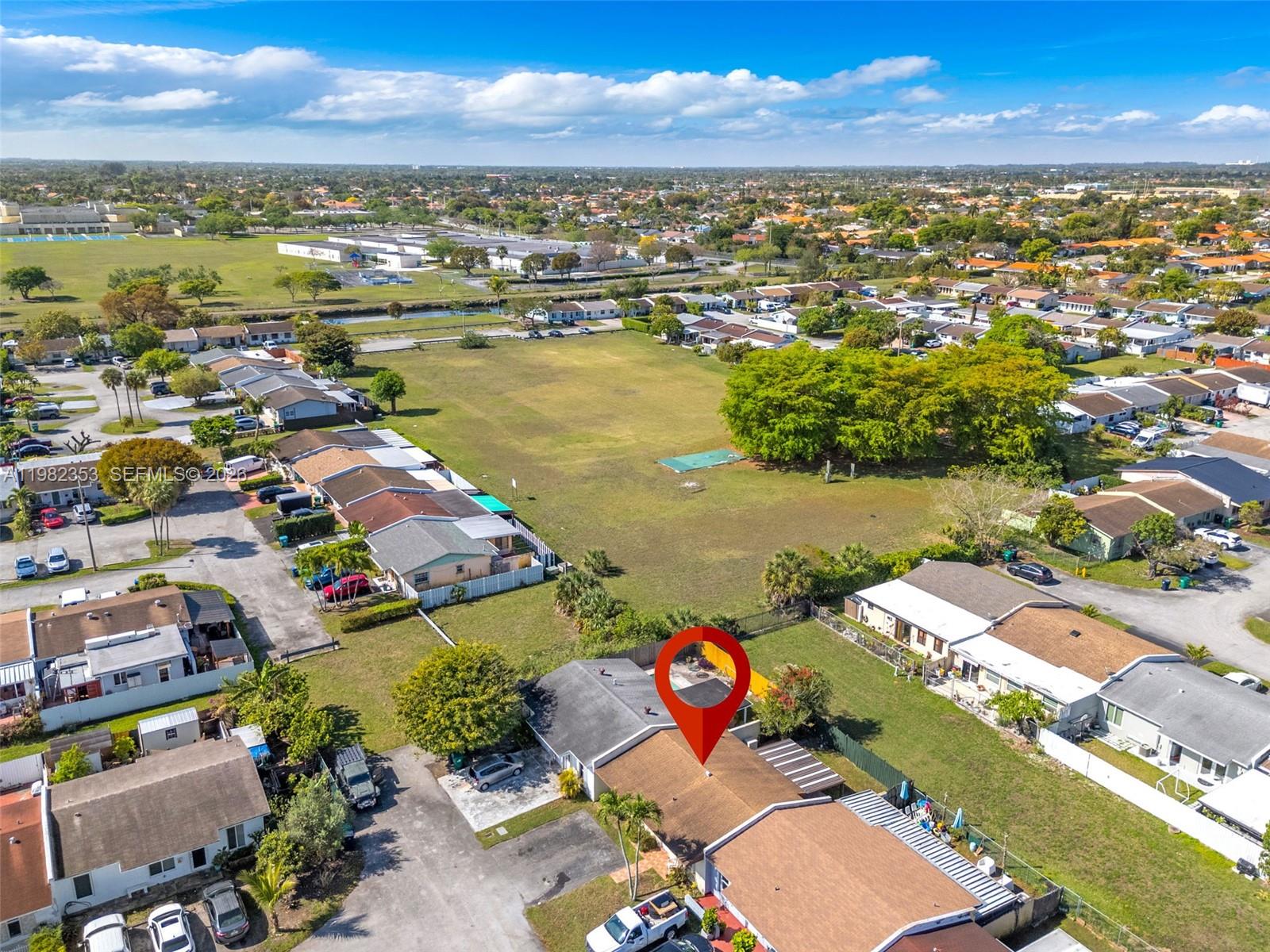 12983 Southwest 18th Terrace Miami, FL 33175 - Photo 23 of 25 an aerial view of residential houses with outdoor space