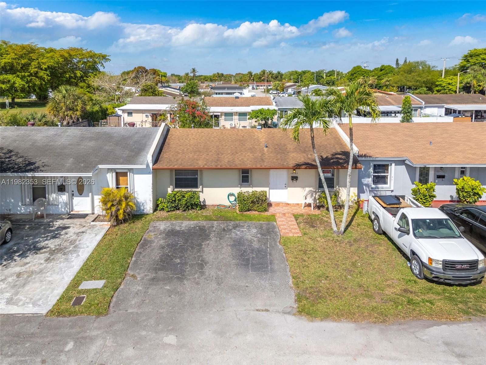 12983 Southwest 18th Terrace Miami, FL 33175 - Photo 25 of 25 an aerial view of a house with a yard and lake view