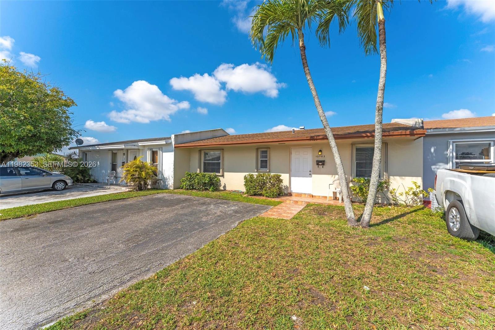 12983 Southwest 18th Terrace Miami, FL 33175 - Photo 3 of 25 a view of a house with backyard and porch