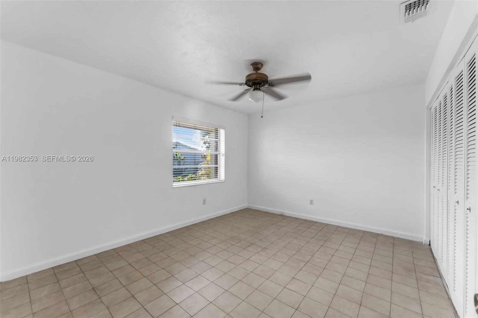 12983 Southwest 18th Terrace Miami, FL 33175 - Photo 10 of 25 a view of an empty room with a window
