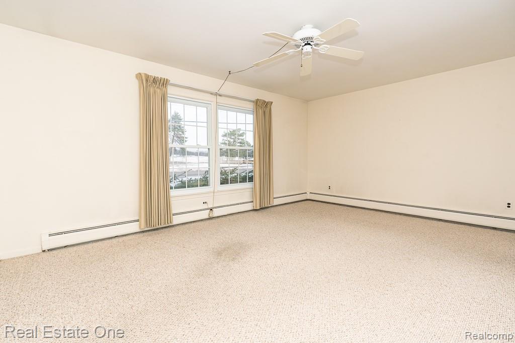 28777 West 11 Mile Road Farmington, MI 48336 - Photo 7 of 53 Spacious Living room with carpet flooring, ceiling fan
