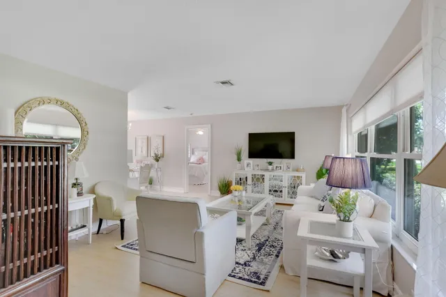a living room with furniture fireplace and a flat screen tv