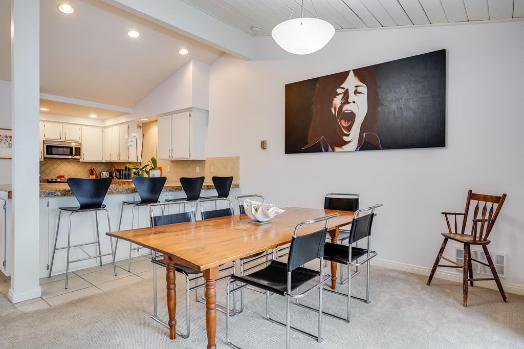 573 South Sierra Avenue, Unit 8 Solana Beach, CA 92075 - Photo 17 of 54 a living room with stainless steel appliances kitchen island granite countertop furniture and a view of kitchen