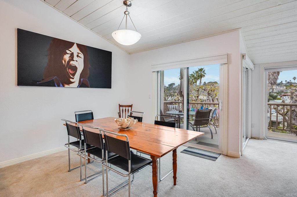 573 South Sierra Avenue, Unit 8 Solana Beach, CA 92075 - Photo 18 of 54 a view of a dining room with furniture and wooden floor