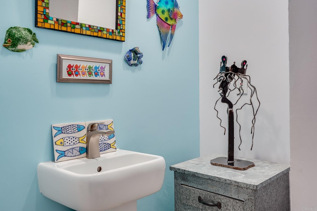 573 South Sierra Avenue, Unit 8 Solana Beach, CA 92075 - Photo 20 of 54 a bathroom with a sink and a mirror