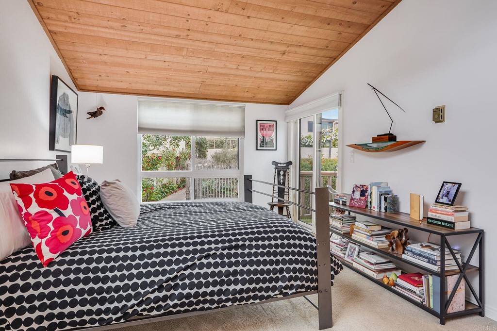 573 South Sierra Avenue, Unit 8 Solana Beach, CA 92075 - Photo 23 of 54 a bedroom with furniture and a window