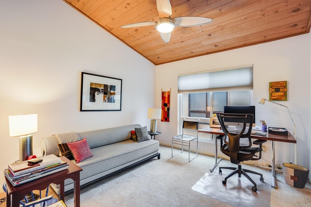 573 South Sierra Avenue, Unit 8 Solana Beach, CA 92075 - Photo 28 of 54 a living room with furniture a ceiling fan and a rug