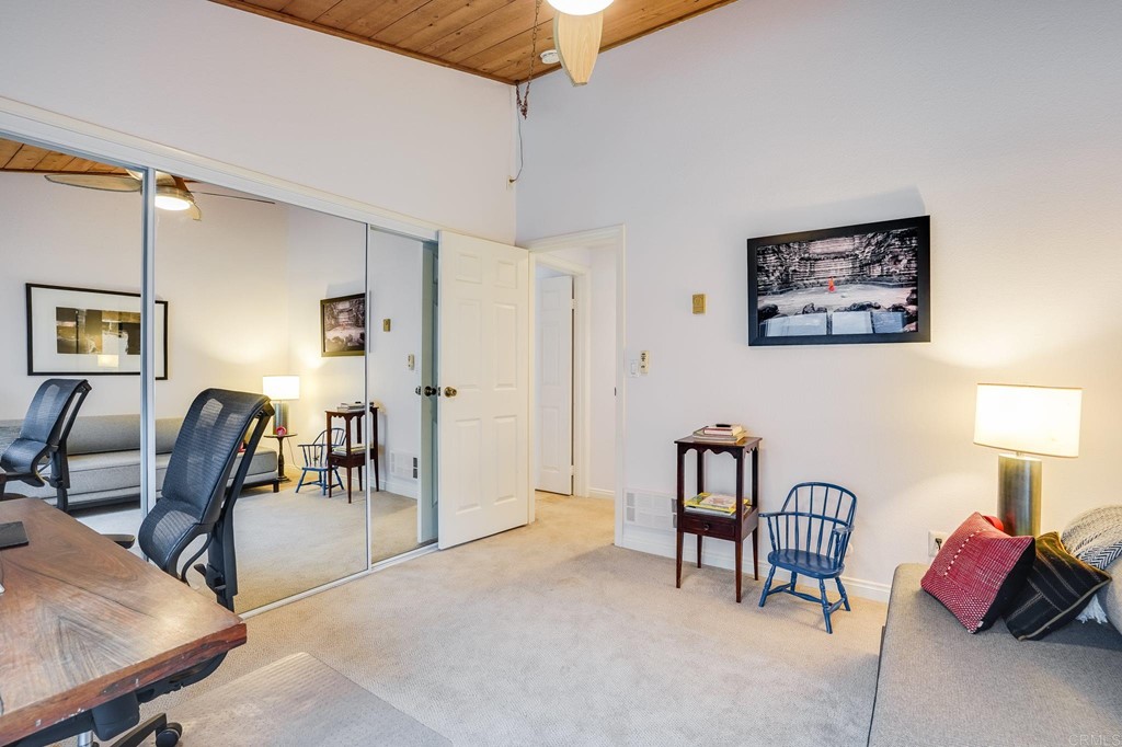573 South Sierra Avenue, Unit 8 Solana Beach, CA 92075 - Photo 29 of 54 a bedroom with furniture and a chair