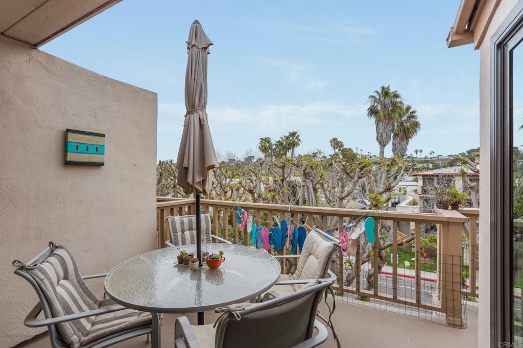 573 South Sierra Avenue, Unit 8 Solana Beach, CA 92075 - Photo 34 of 54 a view of a dining room with furniture window and outside view