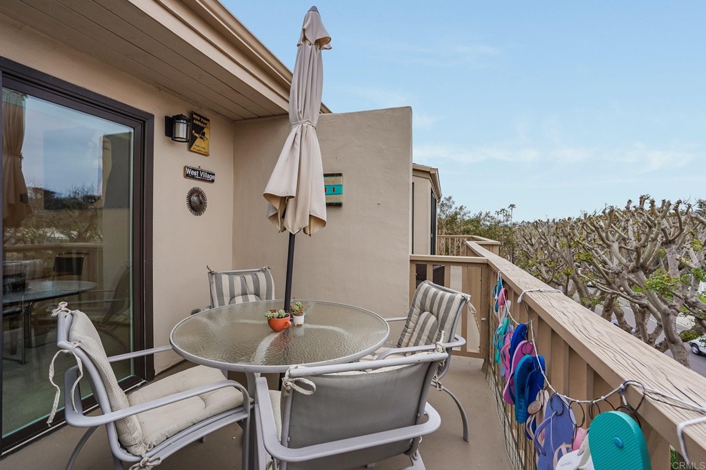 573 South Sierra Avenue, Unit 8 Solana Beach, CA 92075 - Photo 37 of 54 a balcony with table and chairs
