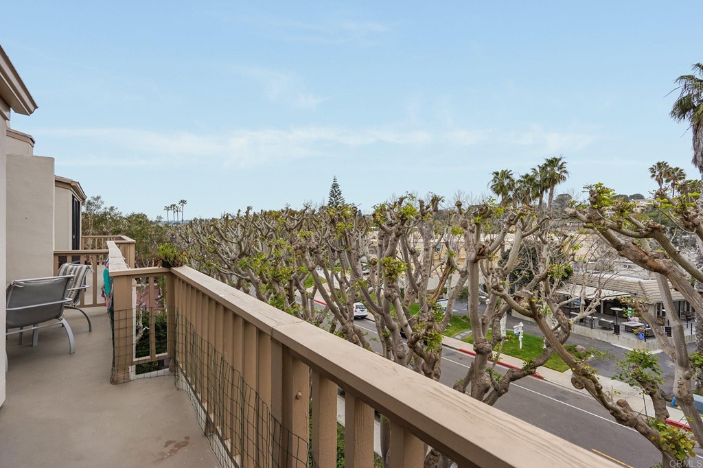 573 South Sierra Avenue, Unit 8 Solana Beach, CA 92075 - Photo 38 of 54 a balcony with wooden floor and city view