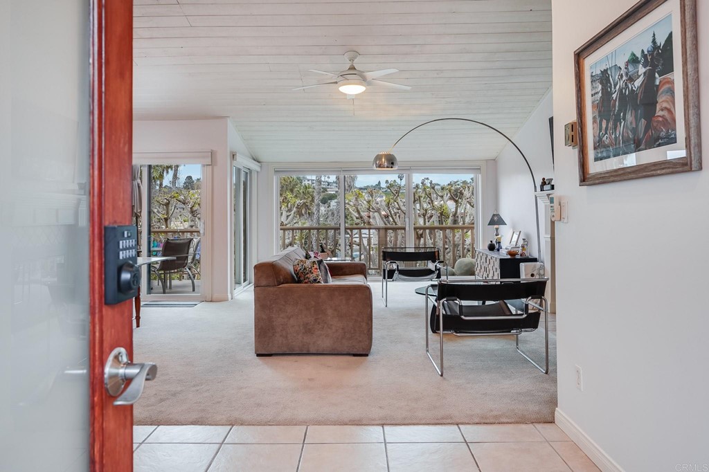 573 South Sierra Avenue, Unit 8 Solana Beach, CA 92075 - Photo 5 of 54 a living room with furniture and a potted plant