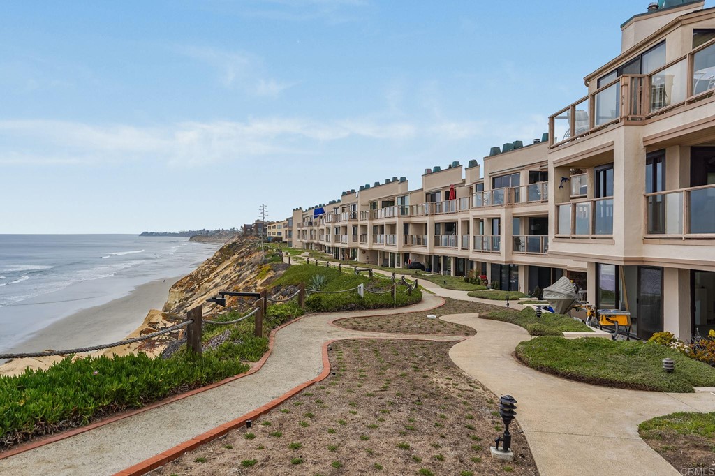 573 South Sierra Avenue, Unit 8 Solana Beach, CA 92075 - Photo 43 of 54 a view of a building with garden space and sitting area