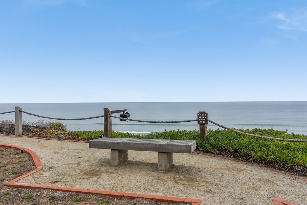 573 South Sierra Avenue, Unit 8 Solana Beach, CA 92075 - Photo 44 of 54 a view of a terrace with a bench and some trees