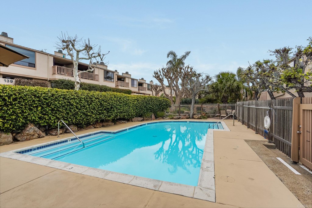 573 South Sierra Avenue, Unit 8 Solana Beach, CA 92075 - Photo 46 of 54 a view of a swimming pool with a patio and a yard