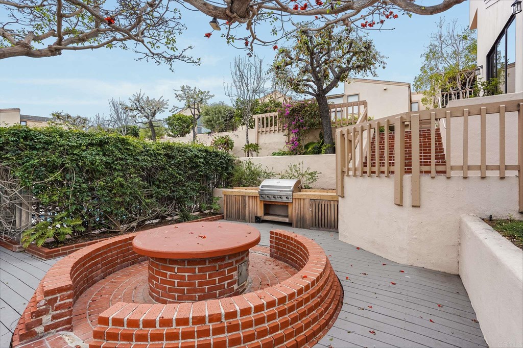 573 South Sierra Avenue, Unit 8 Solana Beach, CA 92075 - Photo 48 of 54 a view of a chairs and table on the deck in front of house