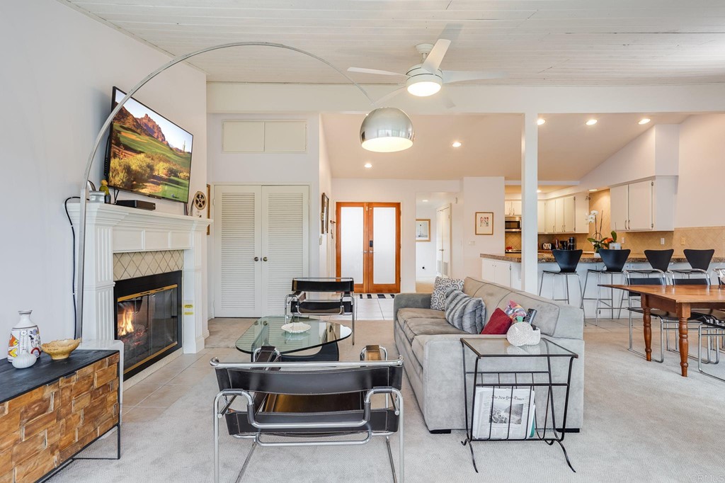 573 South Sierra Avenue, Unit 8 Solana Beach, CA 92075 - Photo 8 of 54 a living room with furniture and a fireplace