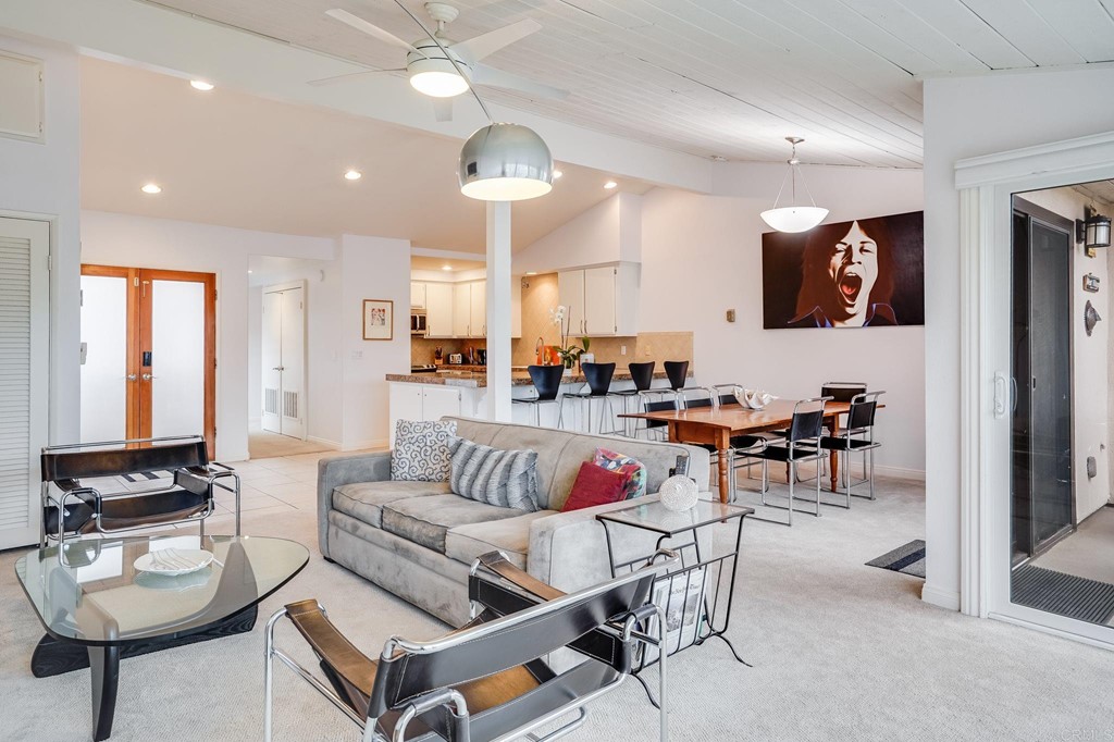 573 South Sierra Avenue, Unit 8 Solana Beach, CA 92075 - Photo 9 of 54 a living room with furniture and a large window