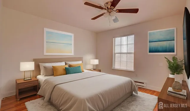 a bedroom with a bed and a tv